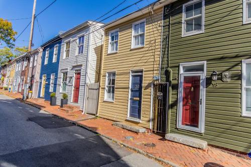 a row of colorful houses on a street at Naval Academy Gate 1 in Annapolis