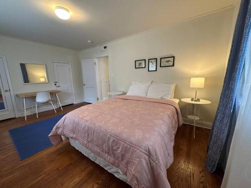 a bedroom with a large bed and a desk at Prime Spot Staysimple Comfort, Perfect Location in Annapolis
