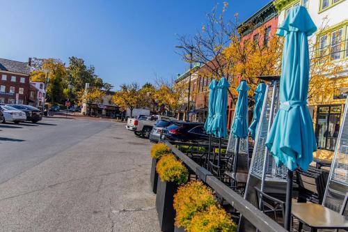 a row of blue umbrellas sitting in front of a street at Naval Academy Gate 1 in Annapolis