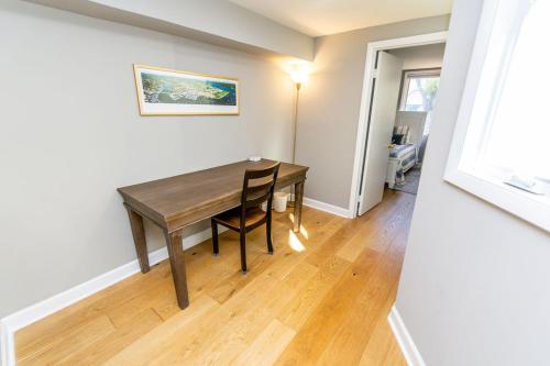 a dining room with a wooden table in a room at Naval Academy Gate 1 in Annapolis