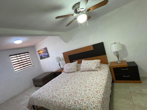 a bedroom with a bed and a ceiling fan at La Alameda you will feel pampered by the comfort in Nuevo Casas Grandes