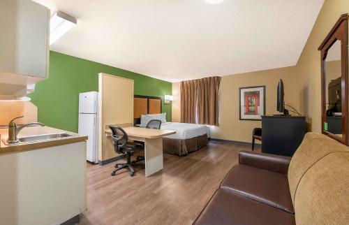 a hotel room with a bed and a desk at Extended Stay America Suites - Phoenix - Mesa in Mesa