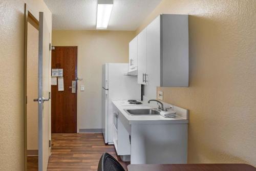 a kitchen with a sink and a refrigerator at Extended Stay America Suites - Philadelphia - Mt Laurel - Crawford Place in Mount Laurel