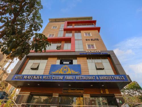 a tall building with a sign on it at Super Townhouse Qualia Prime in Hyderabad