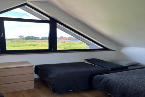 Ένα ή περισσότερα κρεβάτια σε δωμάτιο στο Family-friendly holiday home in Mielenko