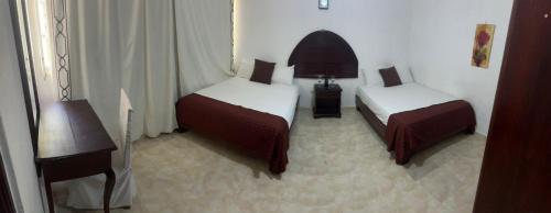 Hotel Nuevo Amanecerにあるベッド