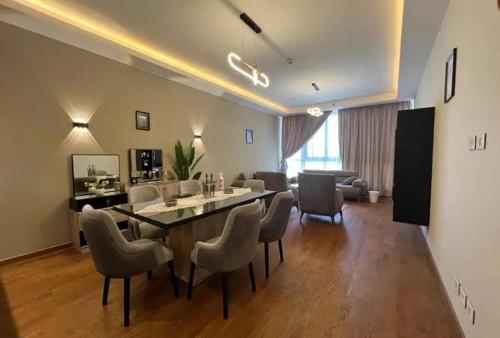 a living room with a dining room table and chairs at Randooo hoo in Kafr El-Shaikh