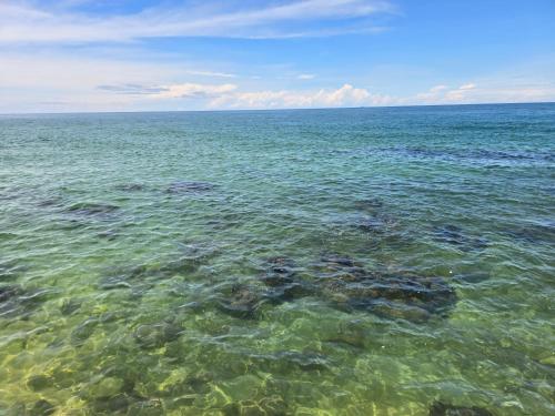 a large body of water with rocks in it at Respect Homestay Phu Quoc in Phu Quoc