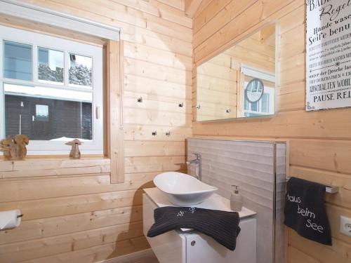 a wooden bathroom with a toilet and a sink at Holiday apartment with 2 bedrooms in Clausthal-Zellerfeld