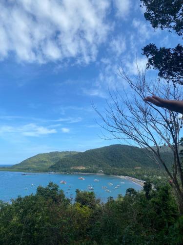 a view of a body of water with a mountain at BACKDOOR VILLA in Baler