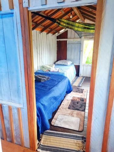 a bedroom with a bed in a house at Casa Anahata in Algodoal