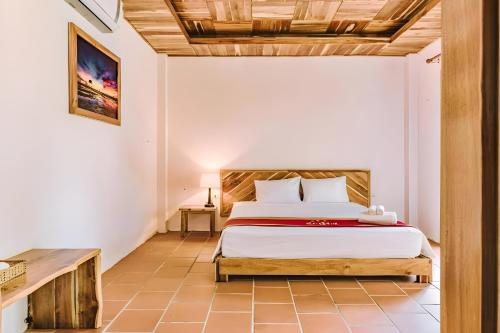 a bedroom with a bed in a room at StarHill Resort Phú Quốc in Phu Quoc