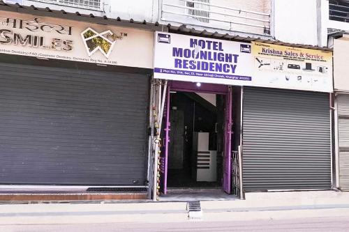 a store front of a building with the door open at Hotel O Moonlight Residency in Mumbai