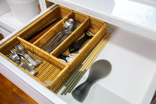 a drawer with forks and spoons and a spoon at 香琉 Kaoru in Miyako Island