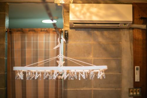 a chandelier hanging from the ceiling in a kitchen at 香琉 Kaoru in Miyako Island