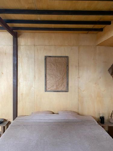 Una cama o camas en una habitación de Los Asentamientos