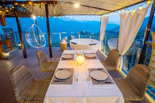 a dining table on a ship with a view at Longji One Art Hotel in Longsheng