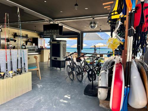 a group of bikes parked in a room with the ocean at FUNPLACE BEACH in Himmafushi