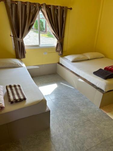 Postel nebo postele na pokoji v ubytování ในวางรีสอร์ท
