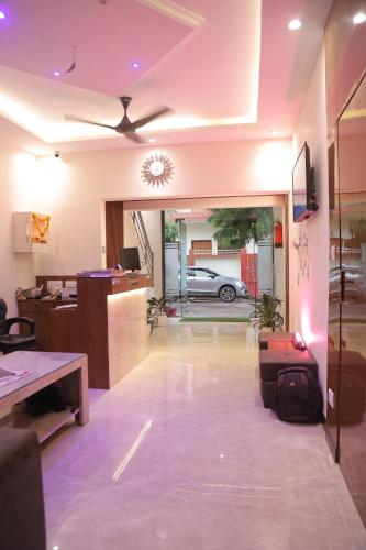 an empty lobby with a car parked in a garage at Taj pyrenes in Agra