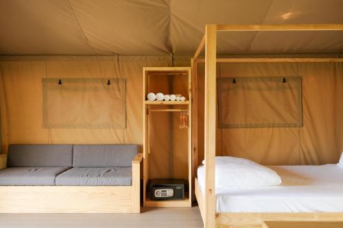 a bedroom with a bunk bed and a bunk bed at WoCAL Resort Ke Ga in Xóm Chum Găng