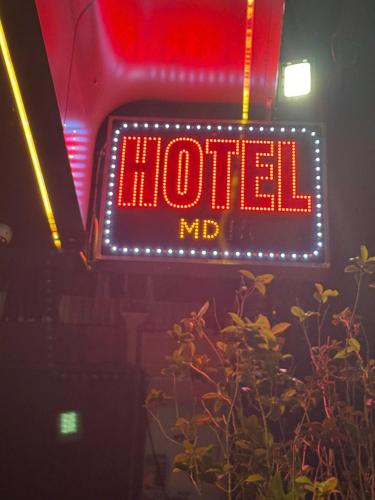 a neon sign that says hotel nd at MD Hotel in Mỹ Lộc