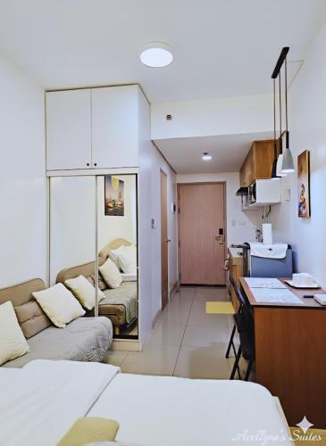 a room with a kitchen and a living room at Acellyne's Suites at Green 2 Residences with Netflix! in Dasmariñas