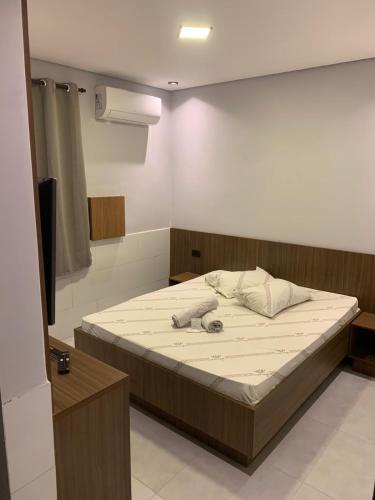 a bedroom with a bed in a room at Hotel Maya in São Paulo