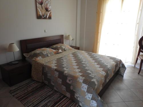 Postel nebo postele na pokoji v ubytování Athena Apartments