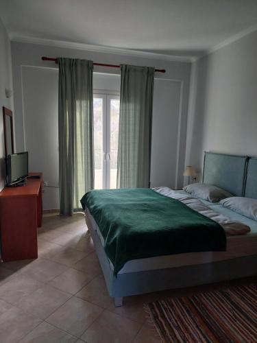 Postel nebo postele na pokoji v ubytování Athena Apartments