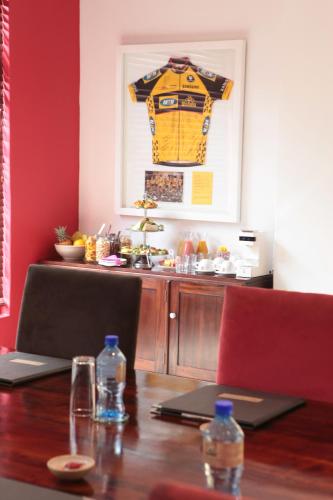 a table with a shirt hanging on a wall at Casterbridge Hollow Boutique Hotel in White River