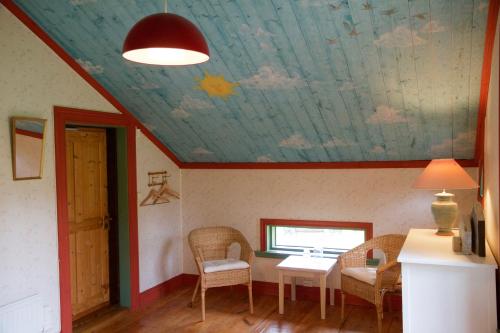 a room with a ceiling with a painting on it at THE LODGE Torsby in Torsby