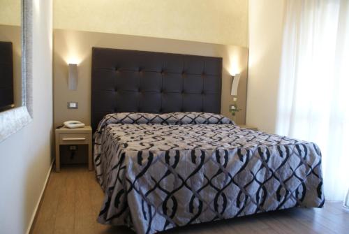 Ένα ή περισσότερα κρεβάτια σε δωμάτιο στο Hotel Michela