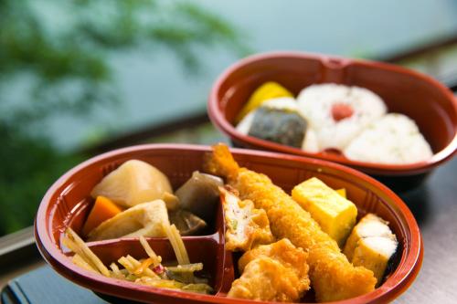 two bowls of food sitting on a table at Tashiro Annex in Yakushima