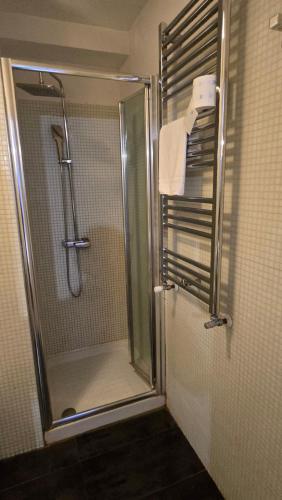 a shower in a bathroom with a glass shower stall at Venice Heart Rooms in Venice