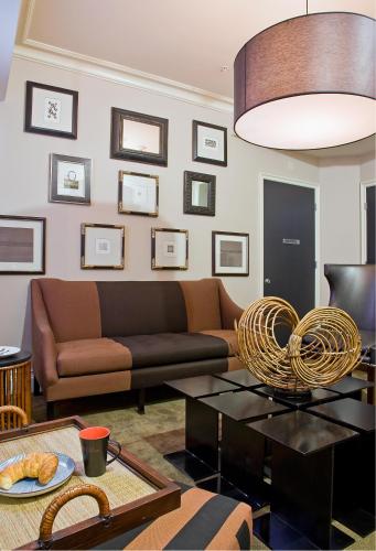 a living room with a couch and a table at Inn at St. Botolph in Boston