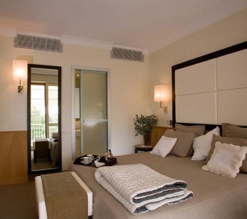 Ліжко або ліжка в номері Hotel Daniel & Ristorante Cocchi
