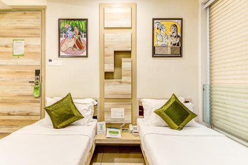 Treebo Daksh Residencyにあるベッド