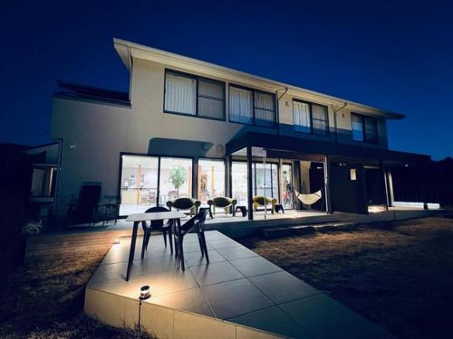 a house with a table and chairs in front of it at H,U,B Unzen - Vacation STAY 78660v in Unzen