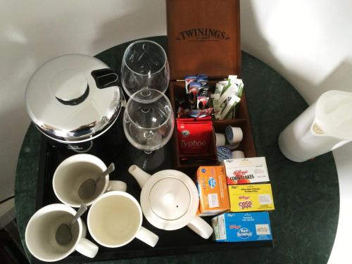 a table with a group of cups and wine glasses at INGRAM ARMS HOTEL, HATFIELD in Doncaster