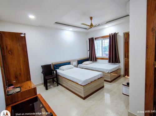 Postel nebo postele na pokoji v ubytování Hotel Rajarhat Palace