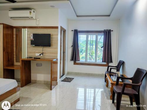 TV a/nebo společenská místnost v ubytování Hotel Rajarhat Palace
