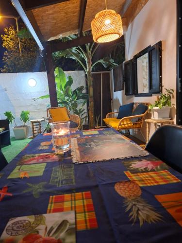 a table with a blue table cloth on it at Ti Caz la Zac in Saint-Louis