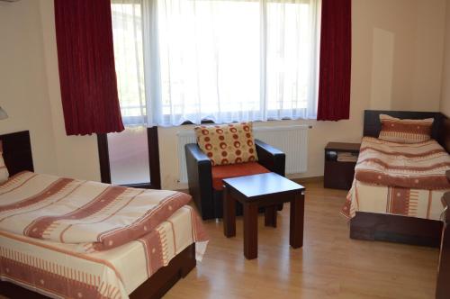 Ένα ή περισσότερα κρεβάτια σε δωμάτιο στο Armira Family Hotel