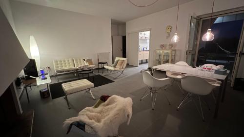 a living room with chairs and a table and a couch at Villa Caporotondo in Pisticci