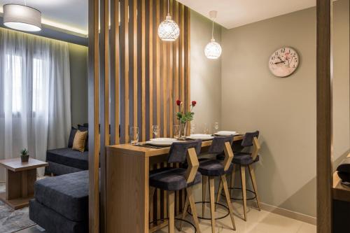 a dining room with a table and some chairs at Mirma City apartment2 Old Town in Chania