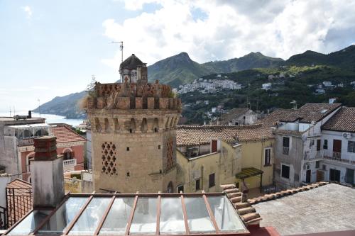 a view of a city with a clock tower at Dalla torre al mare in Vietri sul Mare