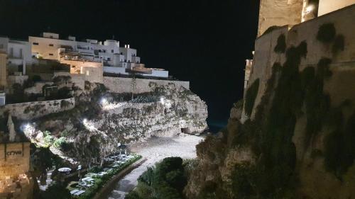a view of a mountain at night at Casa A'Bareis in Polignano a Mare