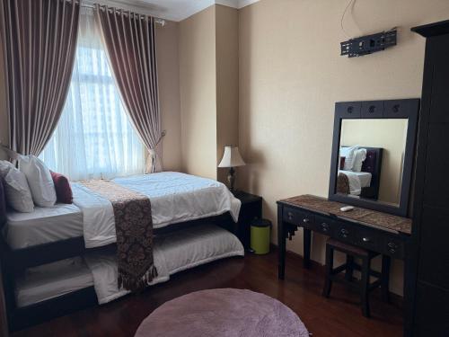 Ένα ή περισσότερα κρεβάτια σε δωμάτιο στο 2 Bedroom apartment at Senayan