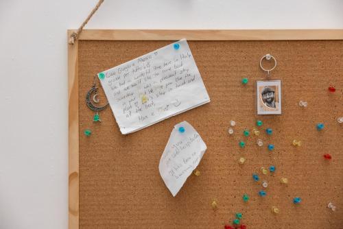 a piece of paper on a cork bulletin board at Antiche Mura in Bari